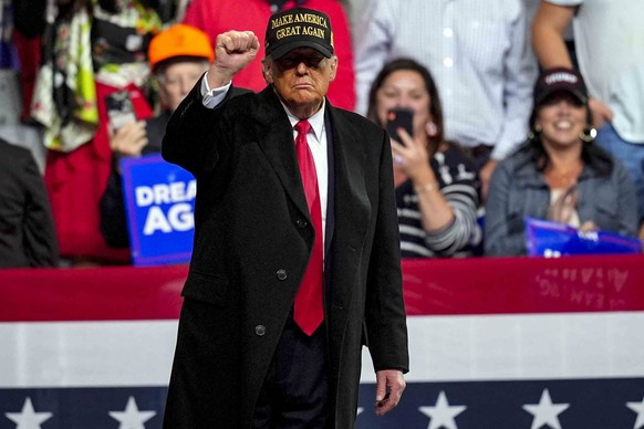 Republican presidential nominee former President Donald Trump gestures at a campaign rally at Atrium Health Amphitheater Sunday, Nov. 3, 2024, in Macon, Ga. (AP Photo/Mike Stewart)