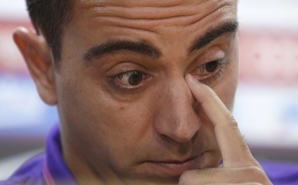 FC Barcelona&#039;s Xavi Hernandez wipes his eye during a press conference at the Sports Center FC Barcelona Joan Gamper in San Joan Despi, Spain, Thursday, May 21, 2015. Barcelona midfielder Xavi Her ...