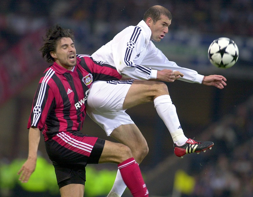 Real Madrid&#039;s Zinedine Zidane, right, is challenged by Bayer Levekusen&#039;s Zoltan Sebescen during the UEFA Champions League final at Hampden Park in Glasgow, Scotland Wednesday May 15, 2002. ( ...