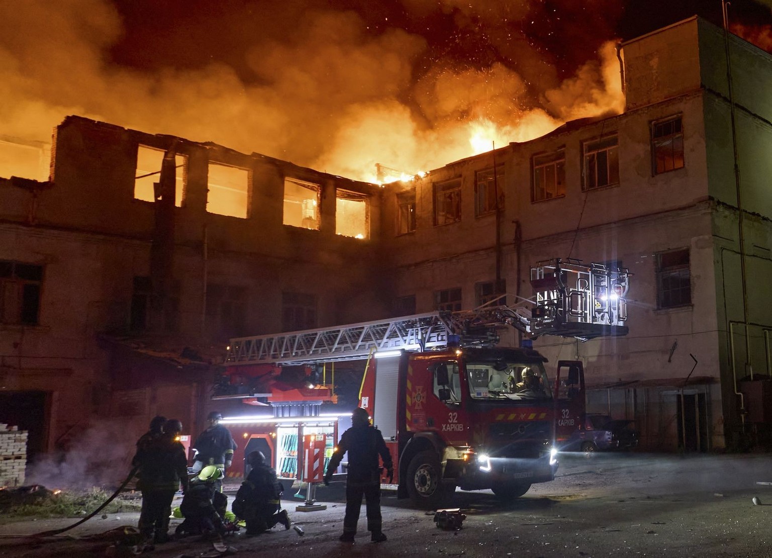 epa13038851 Ukrainian rescuers work at the site of a Russian strike on a civilian enterprise in Kharkiv, Ukraine, 15 June 2026, amid the Russian invasion. In the early hours of 15 June, 4 rescuers wer ...