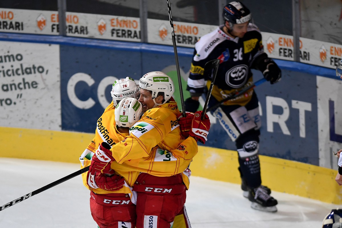 Bienne's player Mike Kuenzle right celebrate the 1 - 3 goal with Bienne's player Marc Antoine Pouliot center and Bienne's player Damien Riat left, during the preliminary round game of N ...