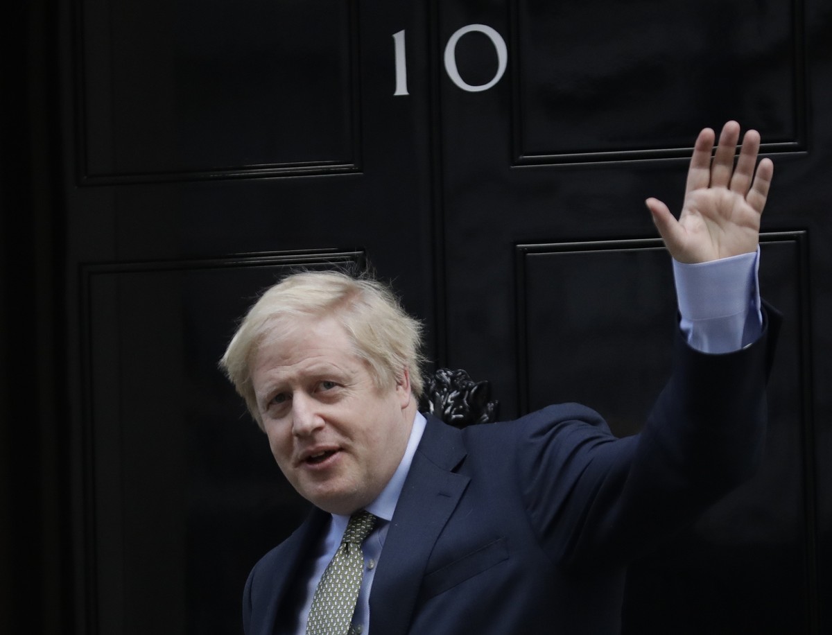 Britain's Prime Minister Boris Johnson returns to 10 Downing Street after meeting with Queen Elizabeth II at Buckingham Palace, London, on Friday, Dec. 13, 2019. Prime Minister Boris Johnson' ...
