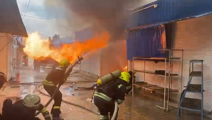 **VIDEO AVAILABLE: CONTACT INFOCOVERMG.COM TO RECEIVE** This video footage shows Ukrainian firefighters battling a blaze after Russian forces shelled the Central Market in Slovyansk at midday on Tuesd ...
