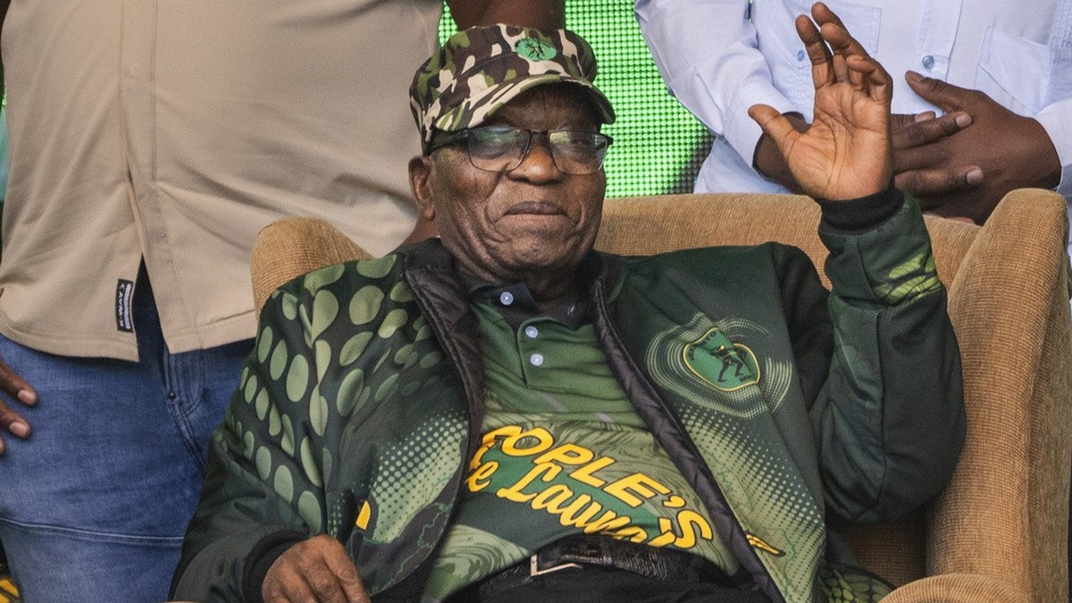 FILE - Former South African President Jacob Zuma greets supporters at Orlando stadium in Soweto, Johannesburg, South Africa, for the launch of his newly formed uMkhonto weSizwe (MK) party's manif ...