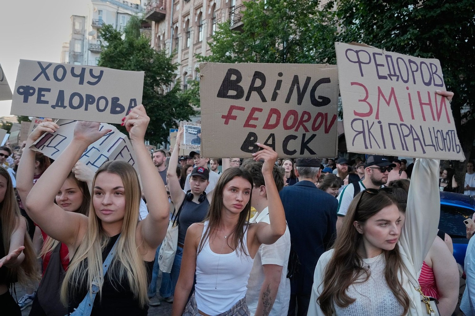 Activists shout slogans during a rally to denounce President Volodymyr Zelenskyy's decision to dismiss Defense Minister Mykhailo Fedorov after six months in the post, Friday, July 17, 2026, Kyiv, ...