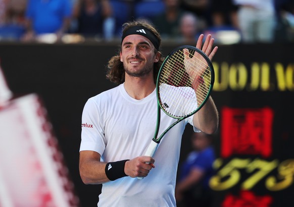 epa10432852 Stefanos Tsitsipas of Greece celebrates after winning the semi final match against Karen Khachanov of Russia at the Australian Open tennis tournament in Melbourne, Australia 27 January 202 ...