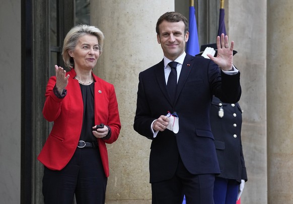 French President Emmanuel Macron, right, waves as he greets European Commission President Ursula von der Leyen at the Elysee Palace in Paris, France, Friday, Jan. 7, 2022. France took over the helm of ...