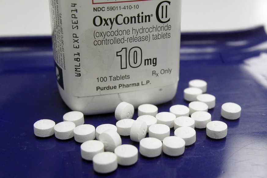 FILE - This Feb. 19, 2013 file photo shows OxyContin pills arranged for a photo at a pharmacy in Montpelier, Vt. A report found drug overdose deaths among U.S. teens inched up in 2015 after years of d ...