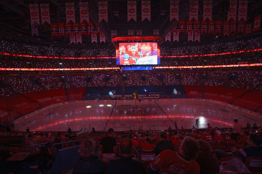 Fans watch a show prior to Game 4 NHL Stanley Cup playoff hockey semifinal action between the Montreal Canadiens and the Vegas Golden Knights in Montreal, Sunday, June 20, 2021.(Paul Chiasson/The Cana ...