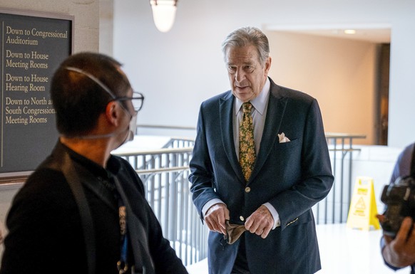 FILE - Paul Pelosi, right, the husband of House Speaker Nancy Pelosi, of California, follows his wife as she arrives for her weekly news conference on Capitol Hill in Washington on March 17, 2022. Pel ...