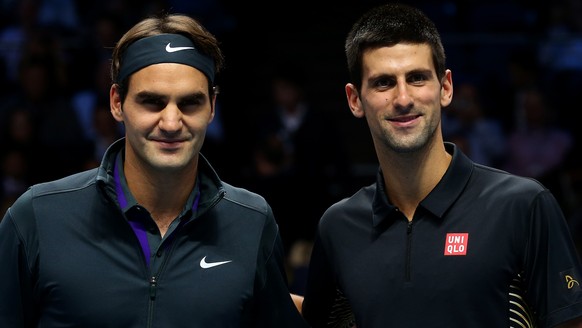 LONDON, ENGLAND - NOVEMBER 12: Roger Federer of Switzerland poses next to Novak Djokovic of Serbia before their men&#039;s singles final match during day eight of the ATP World Tour Finals at O2 Arena ...