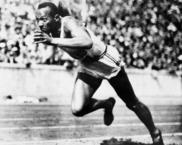 This is an Aug. 14, 1936, file photo showing Jesse Owens competing in one of the heats of the 200-meter run at the 1936 Olympic Games in Berlin. The performance of Jesse Owens will be honored in the s ...