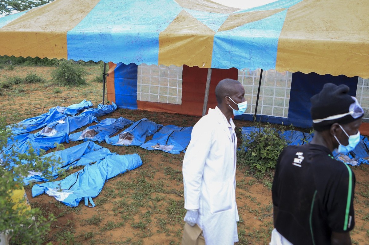 The exhumed bodies of victims of a religious cult are laid out in the village of Shakahola, near the coastal city of Malindi, in southern Kenya Sunday, April 23, 2023. Dozens of bodies have been disco ...