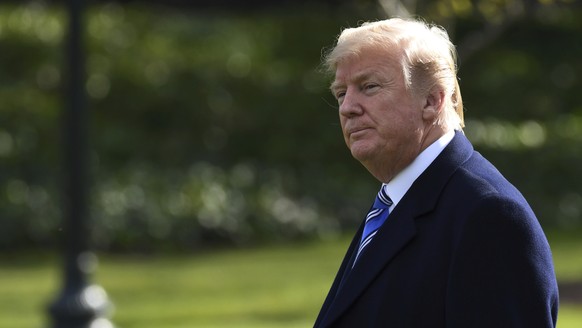 FILE - In this March 23, 2018, file photo, President Donald Trump walks across the South Lawn of the White House in Washington, as he heads to Marine One for a short trip to Andrews Air Force Base. Lo ...