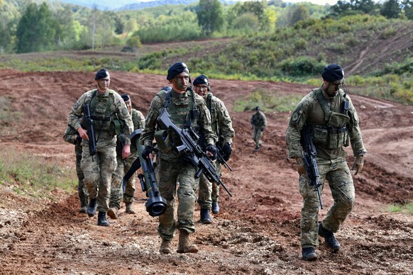 epa12385064 A handout photo made available by the Office of the President of the Republic of Croatia shows Croatian army soldiers, among them one carrying a RGW90 disposable weapon system (C), taking  ...