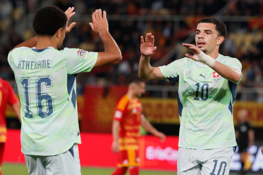 Switzerland's Zachary Athekame, left, and Switzerland's Zeki Amdouni celebrate second goal during the UEFA Nations League soccer match between North Macedonia and Switzerland in Skopje, Nort ...