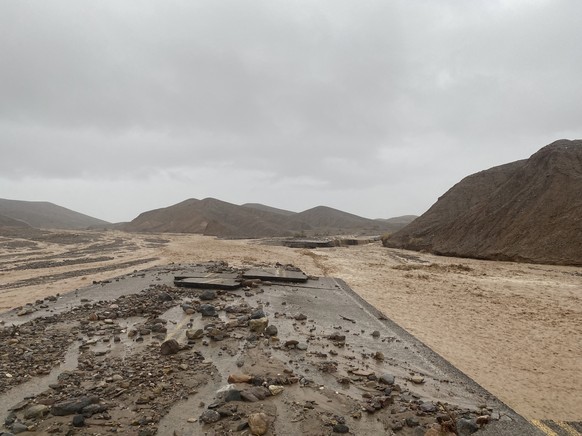 In this photo provided by the National Park Service, Mud Canyon Road is closed due to flash flooding in Death Valley, Calif., Friday, Aug. 5, 2022. Heavy rainfall triggered flash flooding that closed  ...