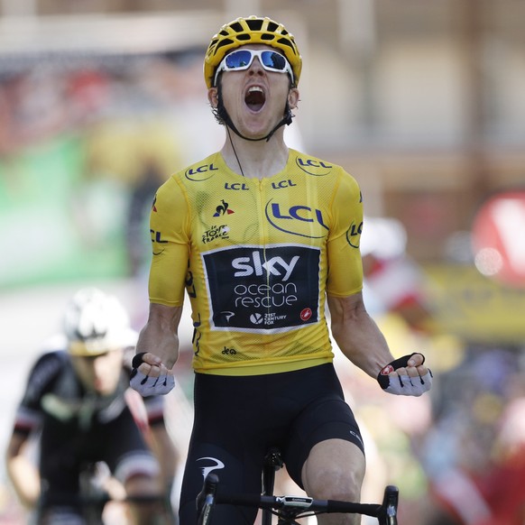 epa06898546 Team Sky rider Geraint Thomas of Britain celebrates as he crosses the finish line to win the 12th stage of the 105th edition of the Tour de France cycling race over 175,5km between Bourg-S ...