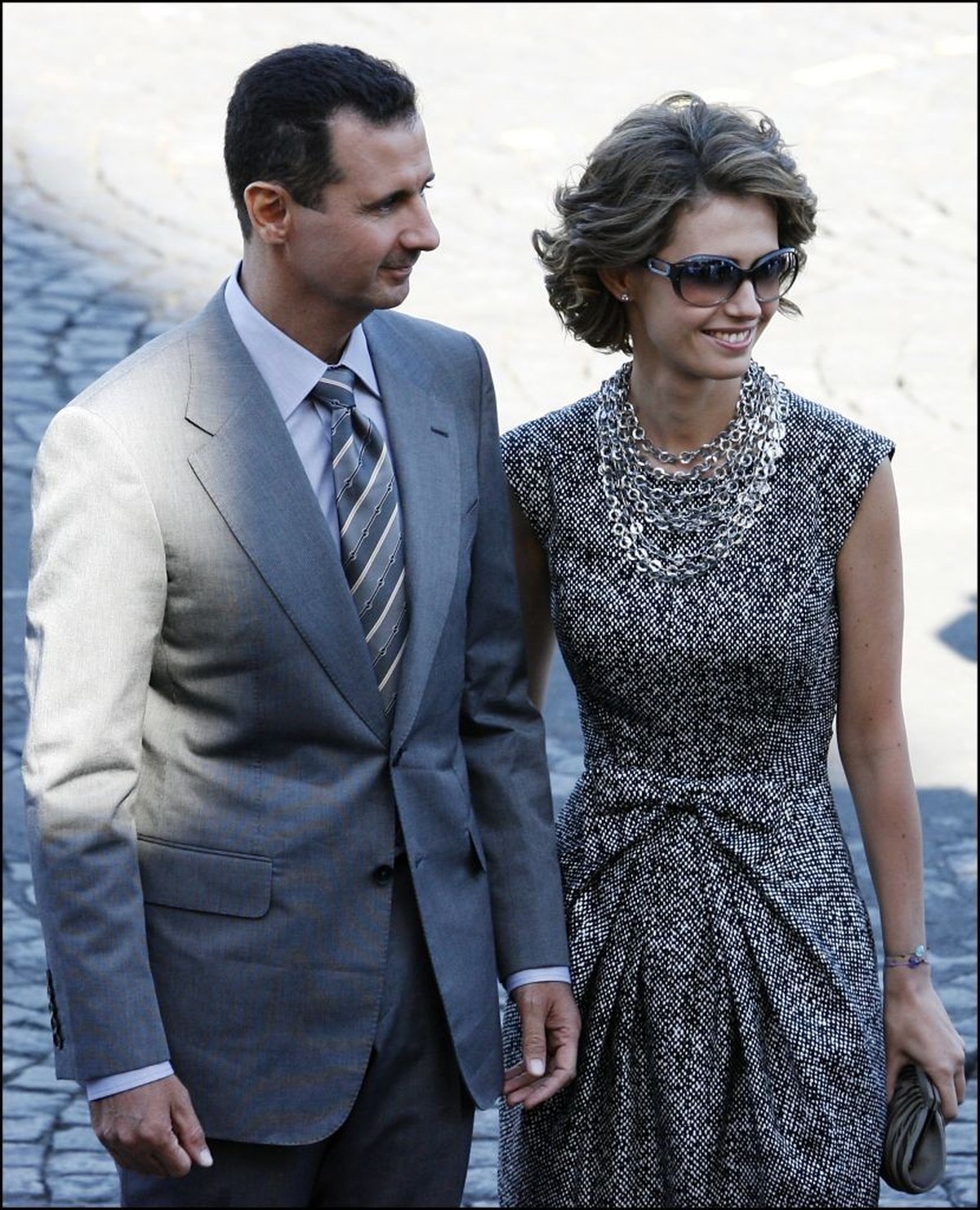 FRANCE - JULY 14: Bastille Day Parade In Paris, France On July 14, 2008 - Bashar Al-Assad and wife Asma. (Photo by Pool BENAINOUS/HOUNSFIELD/Gamma-Rapho via Getty Images)