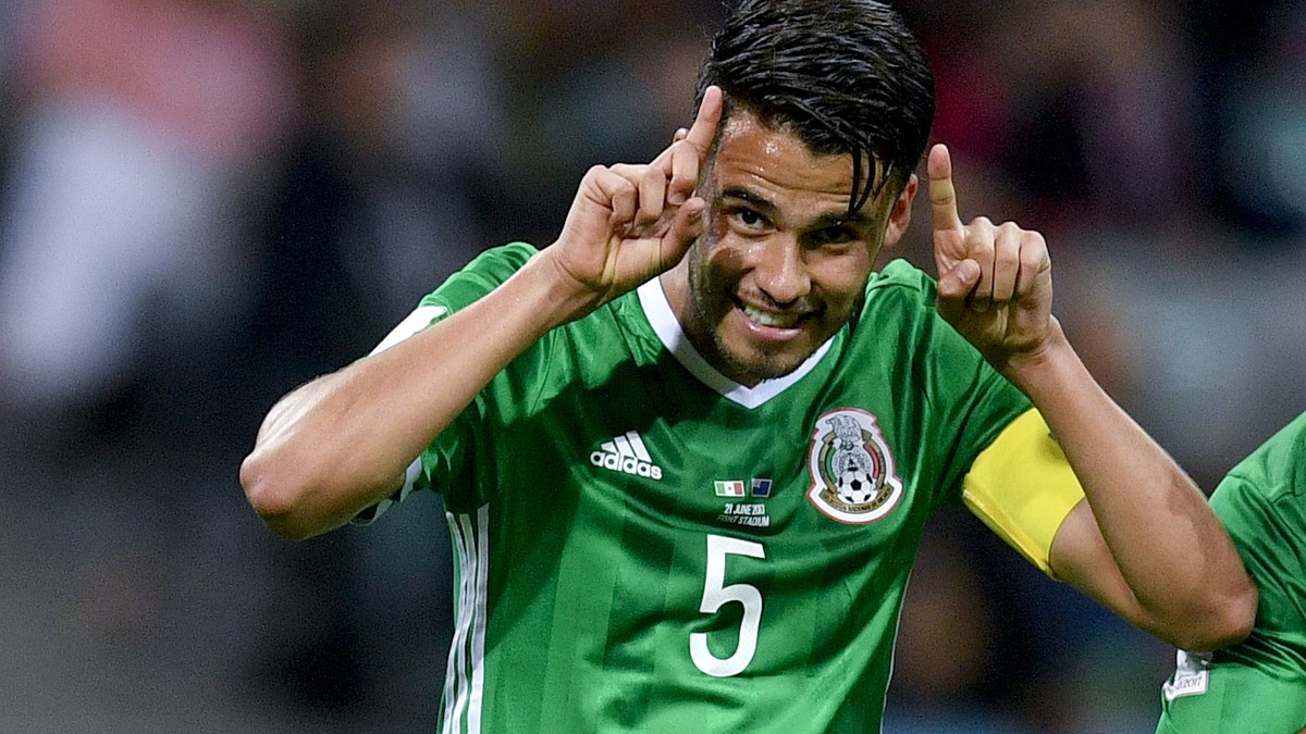 Mexico's Raul Jimenez, right, celebrates with his teammate Diego Reyes after scoring during the Confederations Cup, Group A soccer match between Mexico and New Zealand, at the Fisht Stadium in So ...