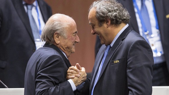 epa09559443 (FILE) - FIFA president Joseph S. Blatter (L) shakes hands with UEFA president Michel Platini (R) after his election as president at the Hallenstadion in Zurich, Switzerland, 29 May 2015 ( ...