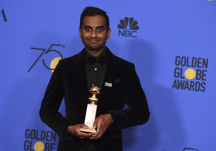 Aziz Ansari poses in the press room with the award for best performance by an actor in a television series - musical or comedy for &quot;Master of None&quot; at the 75th annual Golden Globe Awards at  ...