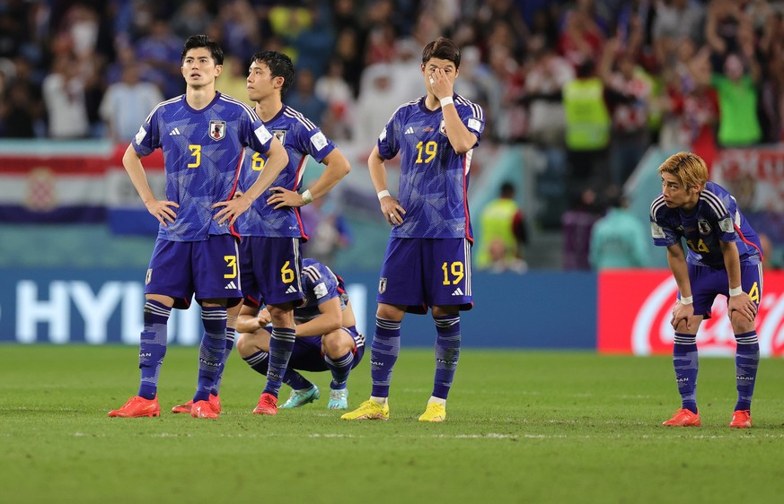 epa10350110 Players of Japan react after the penalty shoot out during the FIFA World Cup 2022 round of 16 soccer match between Japan and Croatia at Al Janoub Stadium in Al Wakrah, Qatar, 05 December 2 ...
