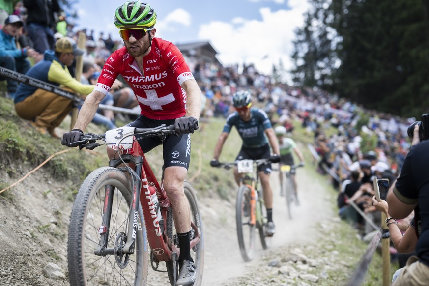 Mathias Flueckiger of Switzerland in action during the UCI Cross Country Mountain Bike race, on Sunday, July 10, 2022, in Lenzerheide, Switzerland. (KEYSTONE/Gian Ehrenzeller)