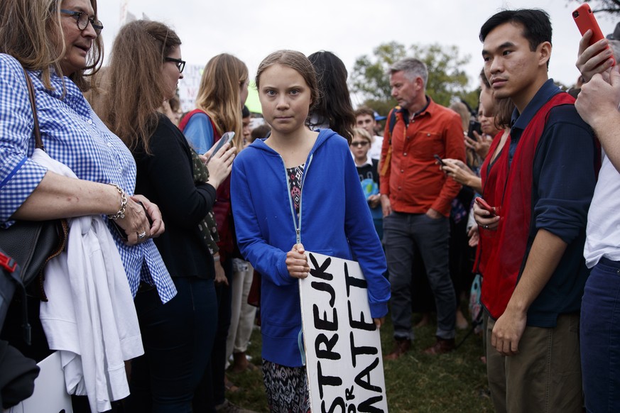 epa07840175 Greta Thunberg (C), the 16 year old climate change activist from Sweden, participates in a School Strike for Climate reform on the Ellipse near the White House in Washington, DC, USA, 13 S ...