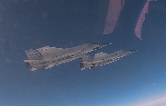 epa12374723 A handout still image taken from handout video provided on 13 September 2025, by the Russian Defence ministry press-service shows Russian MiG-31 fighter jets equipped with hypersonic balli ...