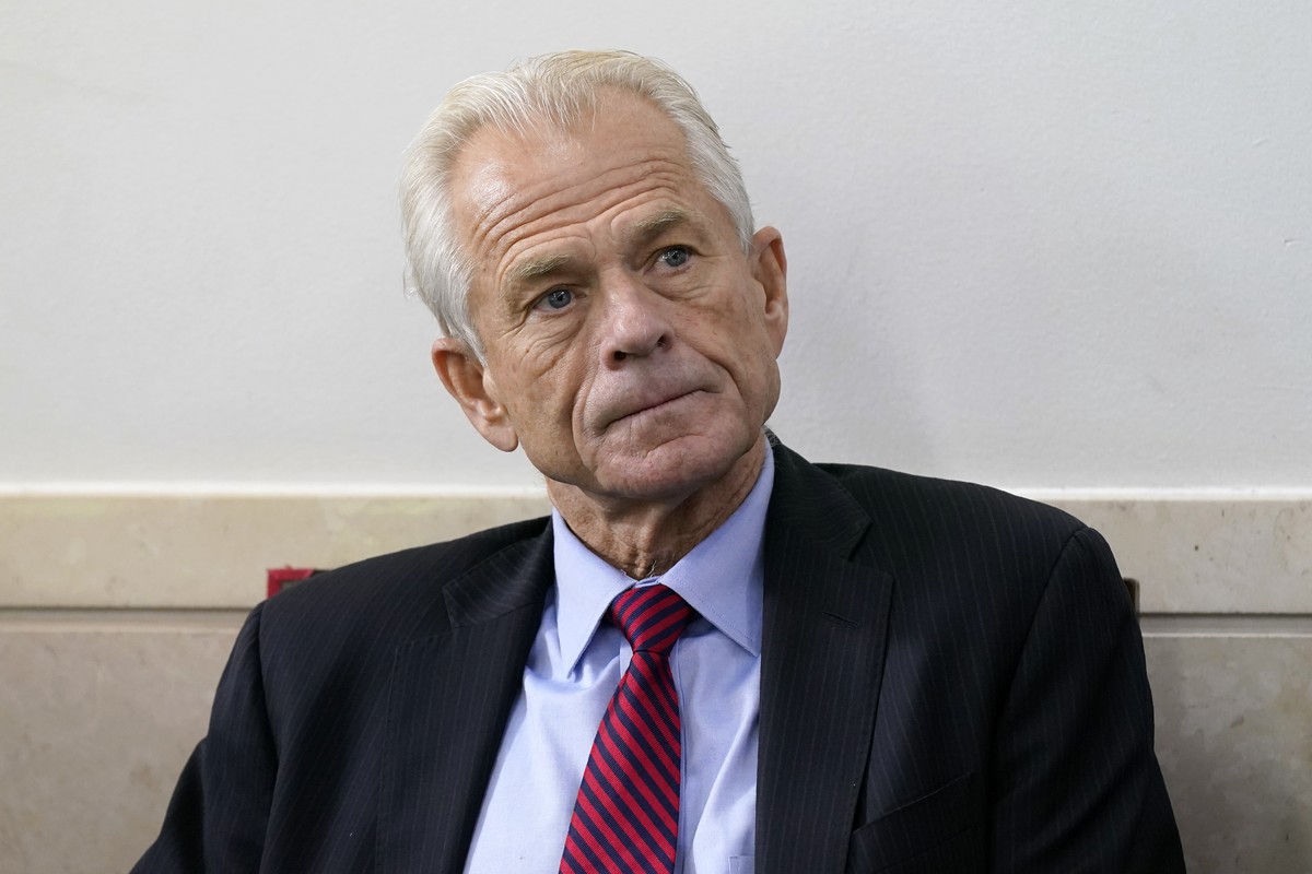 FILE - White House trade adviser Peter Navarro listens as President Donald Trump speaks during a news conference at the White House, Aug. 14, 2020, in Washington. The House committee investigating the ...