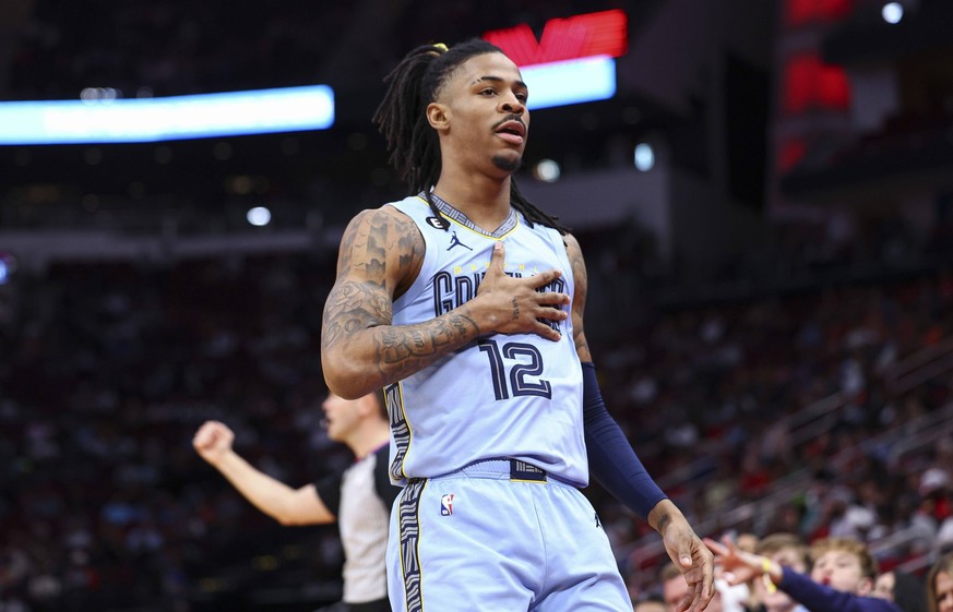 NBA, Basketball Herren, USA Memphis Grizzlies at Houston Rockets Mar 1, 2023 Houston, Texas, USA Memphis Grizzlies guard Ja Morant 12 reacts after scoring a basket during the first quarter against the ...