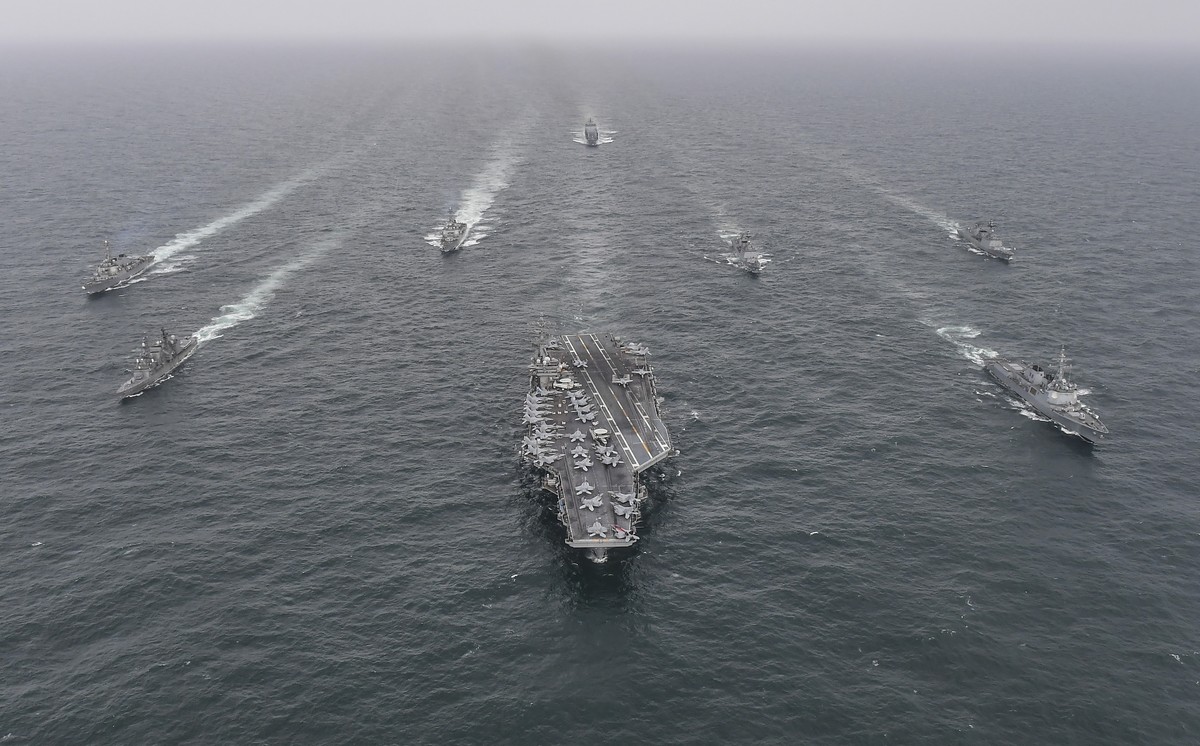 FILE - In this photo provided by the South Korea Defense Ministry, South Korean Navy's destroyer Yulgok Yi I, front row right, U.S. Navy's aircraft carrier USS Nimitz, center, Japan Maritime ...