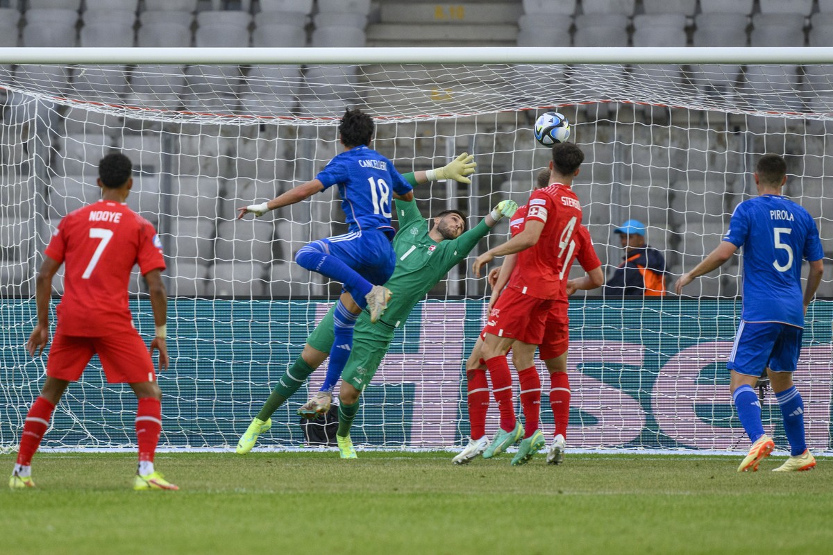 Switzerland's goalkeeper Amir Saipi, center, blocks a ball during a Group D match between Switzerland and Italy at the 2023 UEFA European Under-21 Championship final tournament in the Cluj Arena  ...