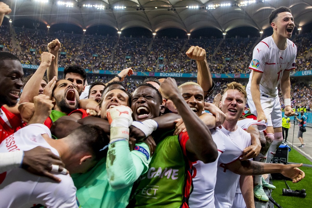 Switzerland's soccer players celebrate after winning the Euro 2020 soccer tournament round of 16 match between France and Switzerland at the National Arena stadium, in Bucharest, Romania, Monday, ...