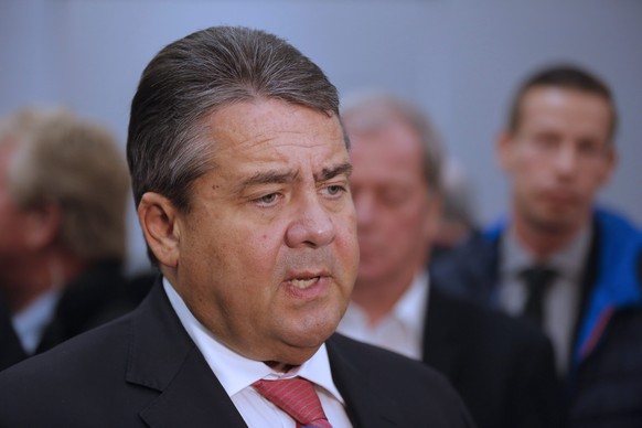 epa05612495 German Minister for Economic Affairs and Energy Sigmar Gabriel speaks to the pressmen before he visits an exhibition by Chinese artist Zeng Fanzhi with the theme &#039;Parcours&#039; at Ul ...