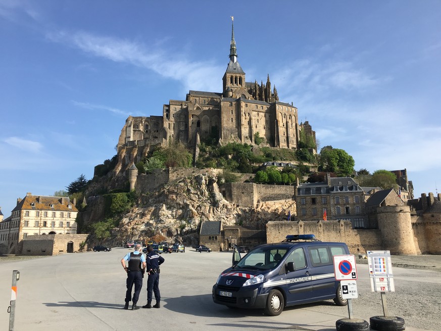 Police attend the scene of an evacuation at Mont Saint-Michel, on France&#039;s northern coast, Sunday April 22, 2018.
Authorities are evacuating tourists and others from the Mont-Saint-Michel abbey a ...
