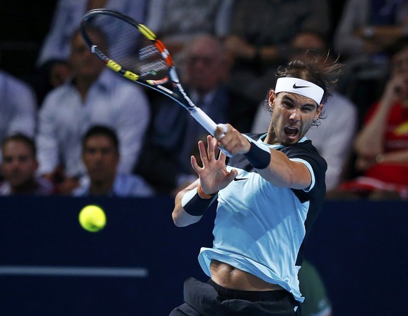 Rafael Nadal of Spain returns a ball to Switzerland&#039;s Roger Federer during their match at the Swiss Indoors ATP men&#039;s tennis tournament in Basel, Switzerland November 1, 2015. REUTERS/Arnd W ...