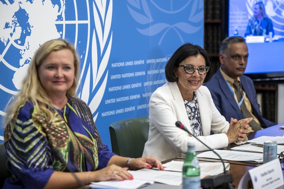 Vasilka Sancin, left, Vice-chair of the Committee, Photini Pazartzis, center, Chairperson of the Committee (OHCHR) and Christopher Arif Bulkan, right, Vice-chair of the Committee, speak about the Huma ...
