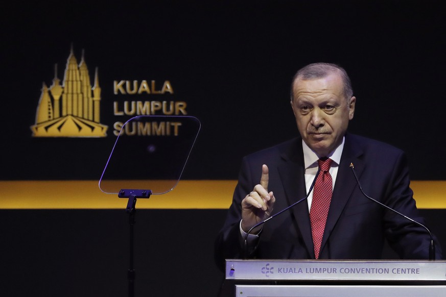 Turkish President Recep Tayyip Erdogan speaks at the Kuala Lumpur Summit in Kuala Lumpur, Malaysia, Thursday, Dec. 19, 2019. Leaders from Turkey, Iran, Qatar, Indonesia and Malaysia address delegates  ...