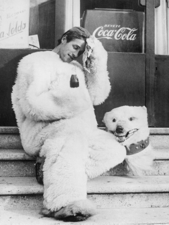 Orig. caption... THE ONE WHO DIDN T FROZE IN CORTINA The only one who didn t freeze during this Olympiad of the cold was an Italian clown dressed as a polar bear. He entertained the crowd in the stree ...