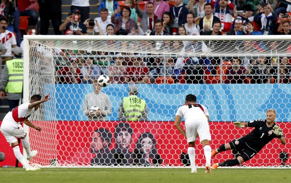 epa06813920 Christian Cueva (L) of Peru fails to score from the penalty spot during the FIFA World Cup 2018 group C preliminary round soccer match between Peru and Denmark in Saransk, Russia, 16 June  ...