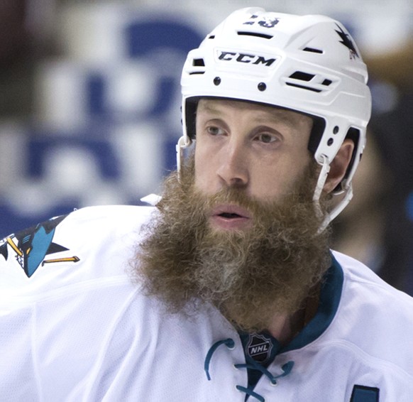 San Jose Sharks&#039; Joe Thornton watches play during the first period of the team&#039;s NHL hockey game against the Vancouver Canucks on Sunday, April 2, 2017, in Vancouver, British Columbia. (Darr ...