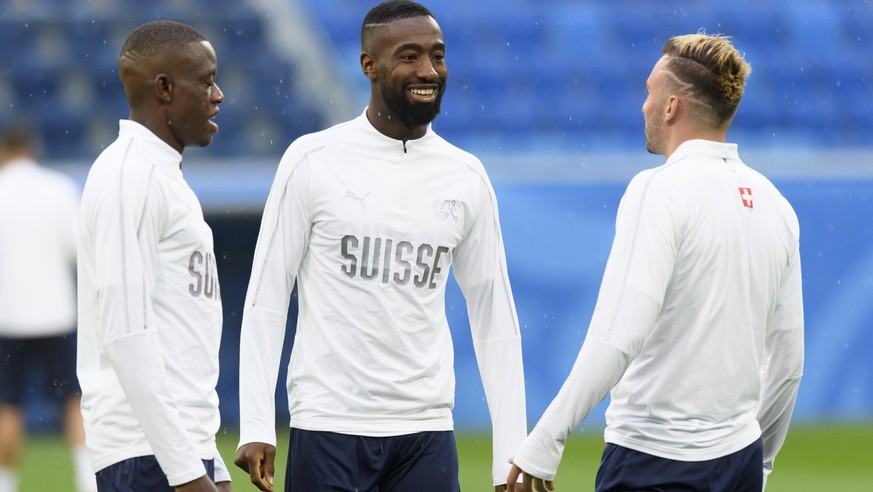 From left, Switzerland&#039;s midfielder Denis Zakaria, Switzerland&#039;s defender Johan Djourou and Switzerland&#039;s forward Josip Drmic during a training session on the eve of the FIFA World Cup  ...