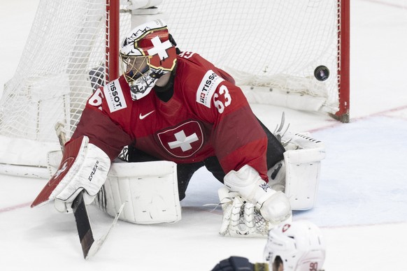Switzerland goalkeeper Leonardo Genoni reacts after the first goal during the Ice Hockey World Championship final match against the Czech Republic in Prague, Czech Republic, at the O2 Arena, Sunday, M ...