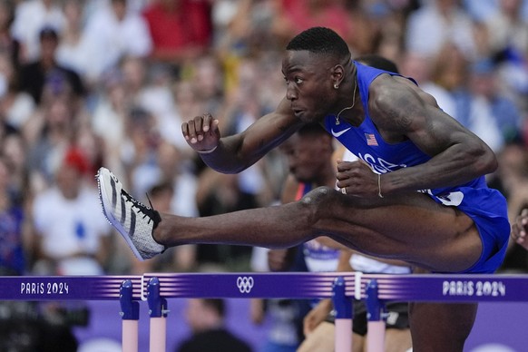 Grant Holloway, of the United States, competes during the men&#039;s 110-meter hurdles semifinal at the 2024 Summer Olympics, Wednesday, Aug. 7, 2024, in Saint-Denis, France. (AP Photo/Matthias Schrad ...