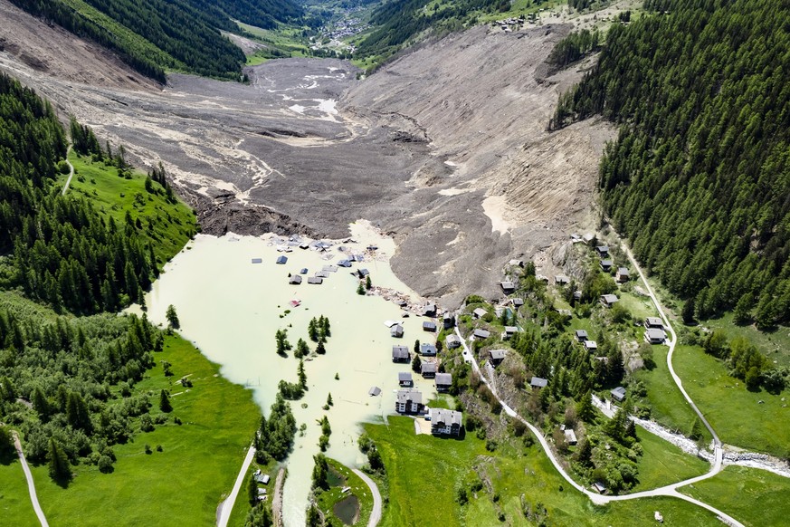 A aerial view captured one day after a massive avalanche, triggered by the collapse of the Birch Glacier, shows the destruction it caused as it swept down to the valley floor and demolishing the villa ...