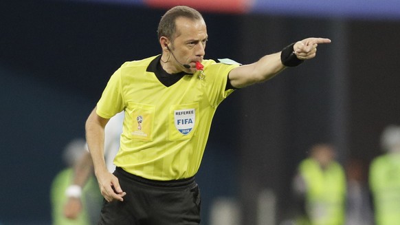 Referee Cuneyt Cakir from Turkey gestures during the group D match between Argentina and Nigeria at the 2018 soccer World Cup in the St. Petersburg Stadium in St. Petersburg, Russia, Tuesday, June 26, ...