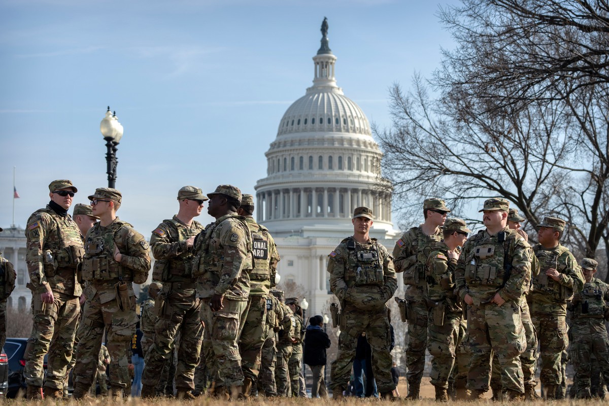 National Guard members gather before the body of Metropolitan Police Department officer Terry Bennett is driven past the Capitol, Thursday, Jan. 8, 2026, in Washington. (AP Photo/Mark Schiefelbein)
Wa ...