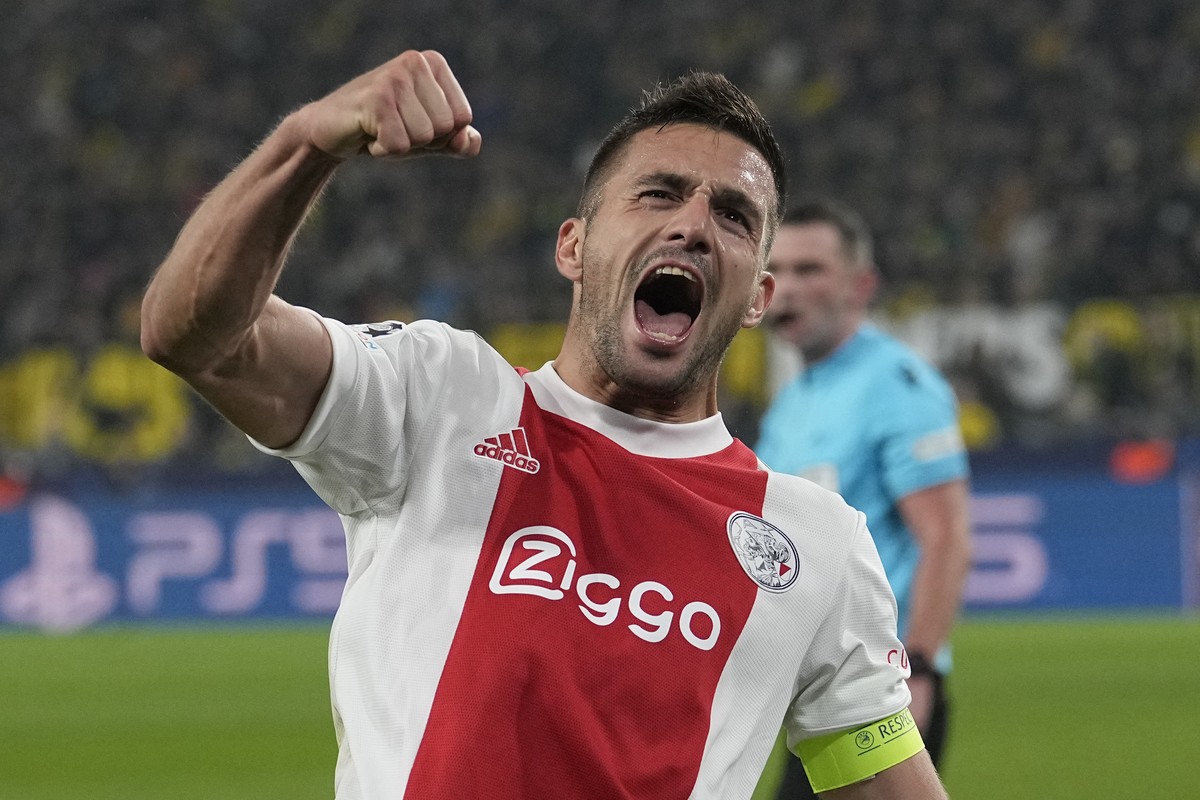Ajax's Dusan Tadic celebrates after scoring his side's opening goal during the Champions League group C soccer match between Borussia Dortmund and Ajax Amsterdam in Dortmund, Germany, Wednes ...
